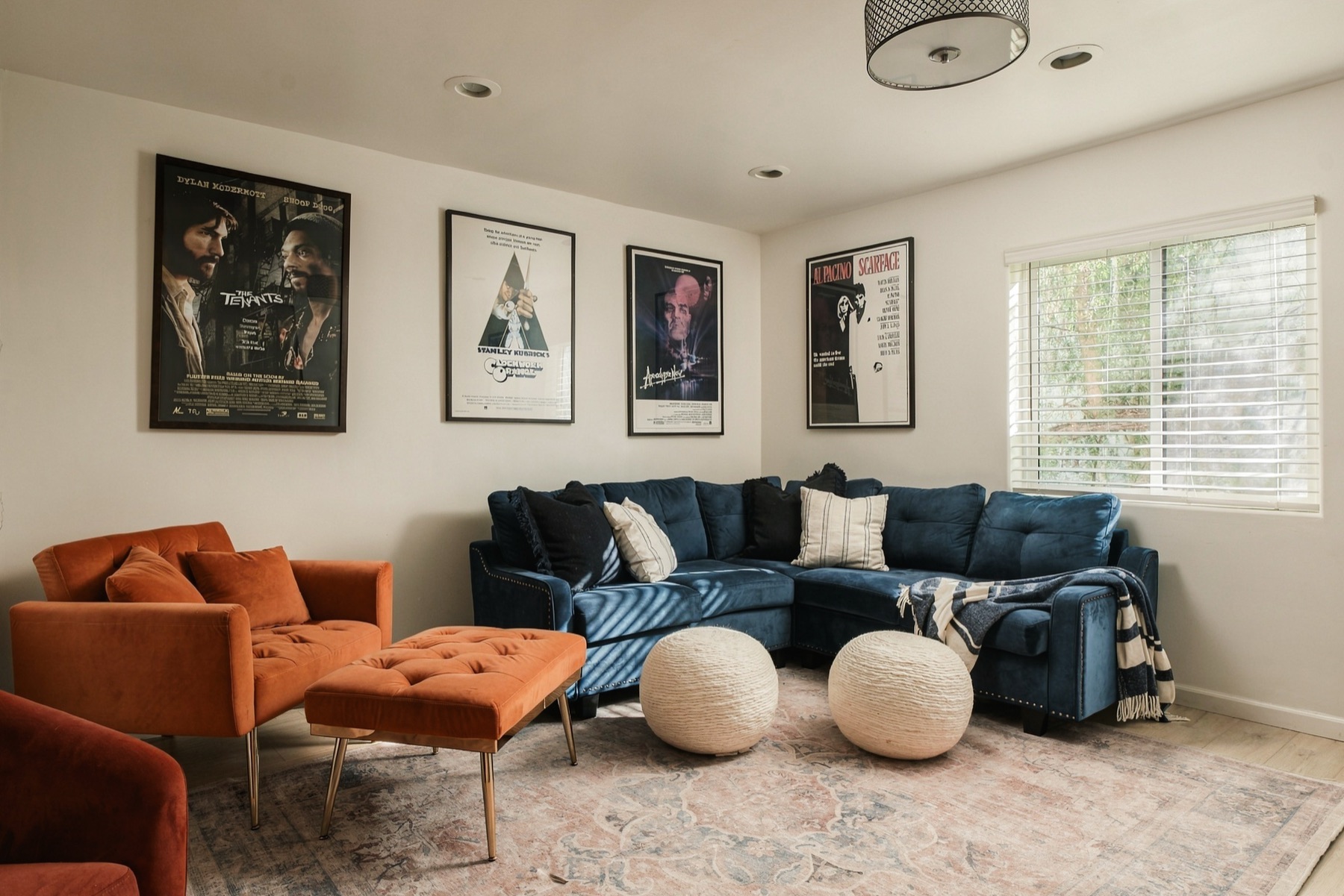 The theater level, with a sectional and framed film posters