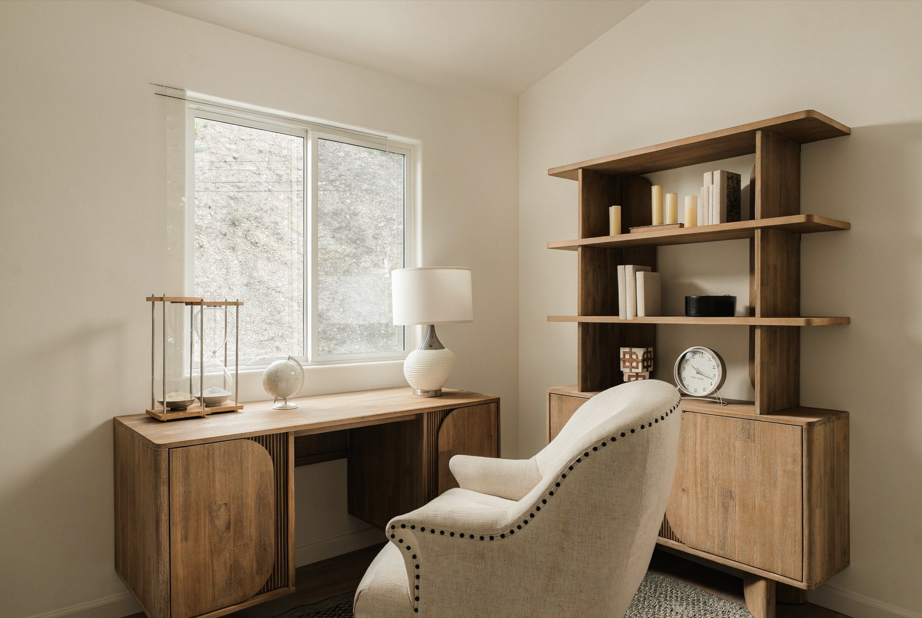 Home office with a wood desk and open shelving