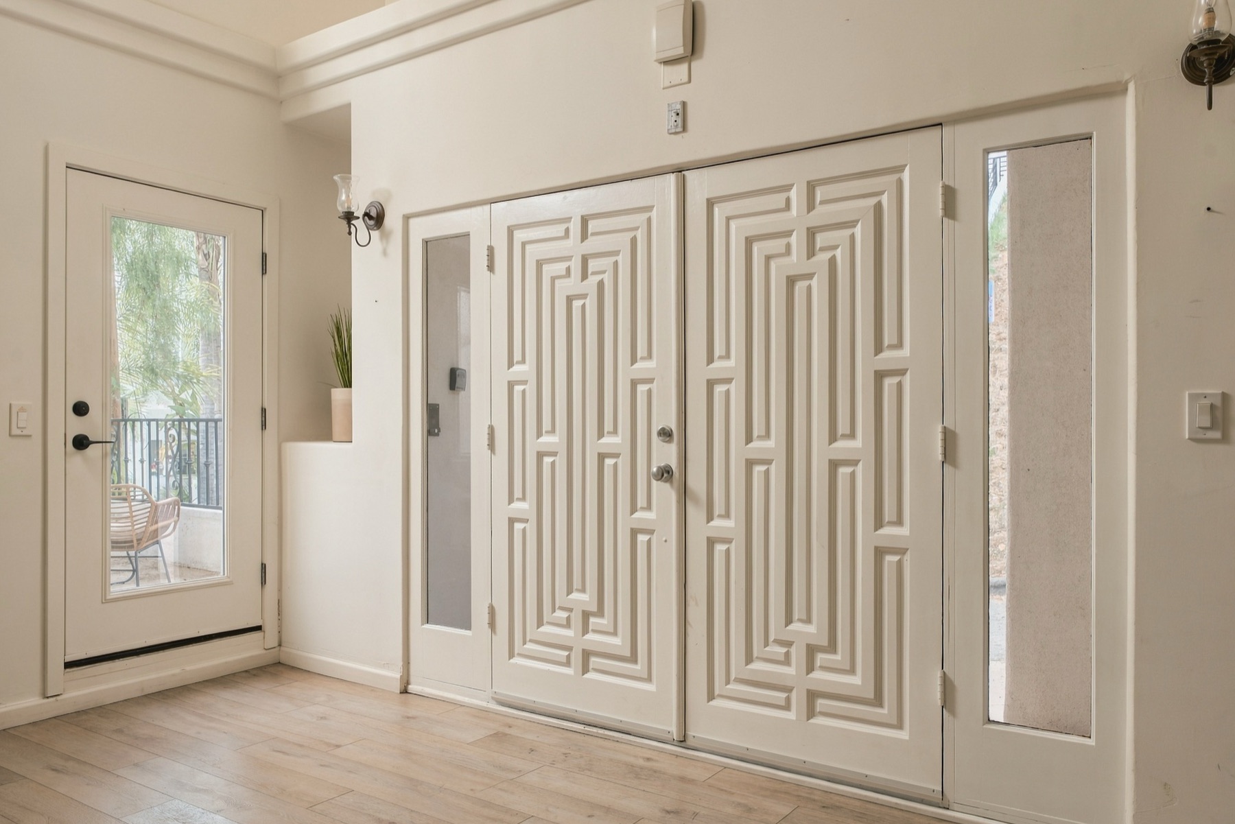 Geometric white double doors at the entry